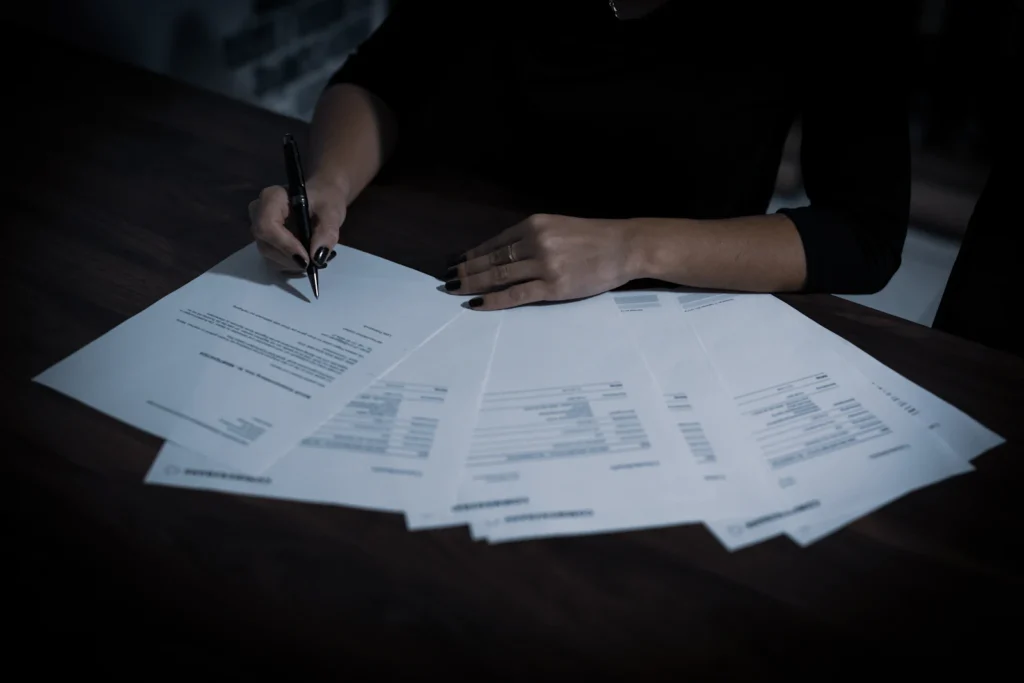 Importers registry paperwork being signed